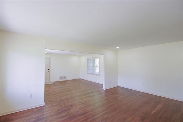 502 W Broadway St, Higginsville, MO 64037 - spare room featuring wood finished floors and baseboards