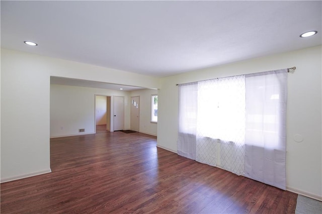 502 W Broadway St, Higginsville, MO 64037 - spare room featuring wood finished floors, recessed lighting, and baseboards