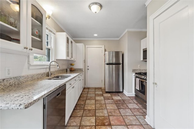 7227 Jefferson St, Kansas City, MO 64114 - kitchen with appliances with stainless steel finishes, a sink, white cabinetry, crown molding, and decorative backsplash