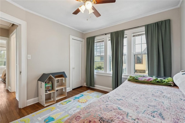 7227 Jefferson St, Kansas City, MO 64114 - bedroom featuring ornamental molding, multiple windows, wood finished floors, baseboards, and ceiling fan