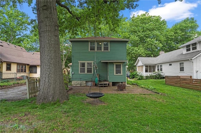 7227 Jefferson St, Kansas City, MO 64114 - rear view of property with an outdoor fire pit