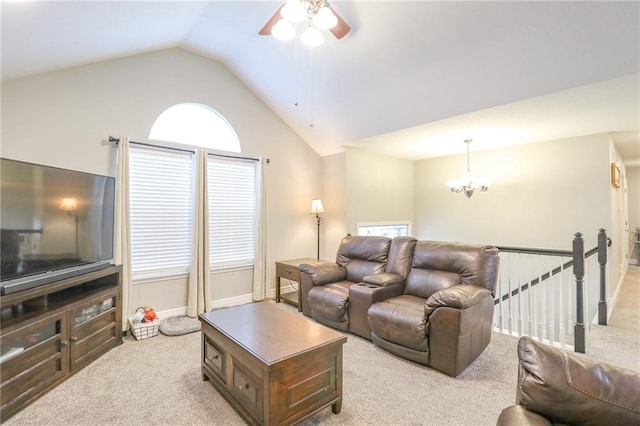 1215 Nottingham Dr, Warrensburg, MO 64093 - carpeted living room featuring baseboards, ceiling fan with notable chandelier, and vaulted ceiling