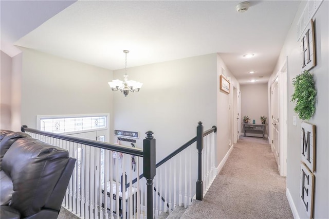 1215 Nottingham Dr, Warrensburg, MO 64093 - hallway featuring light colored carpet, a chandelier, recessed lighting, baseboards, and an upstairs landing