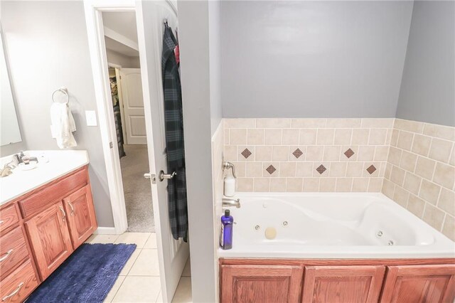 1215 Nottingham Dr, Warrensburg, MO 64093 - full bath with a jetted tub, tile patterned floors, and vanity