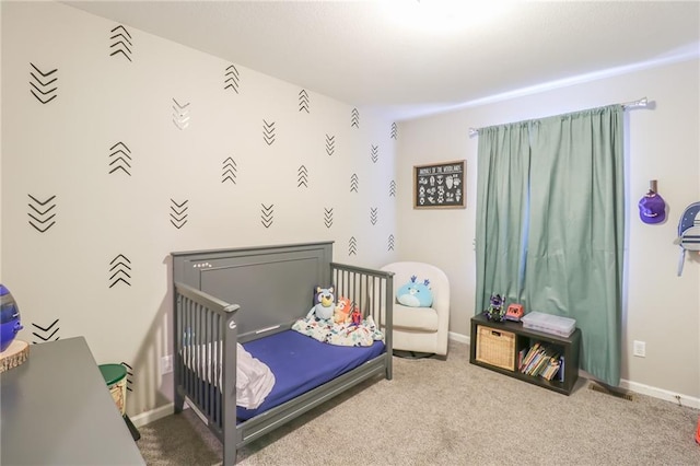 1215 Nottingham Dr, Warrensburg, MO 64093 - carpeted bedroom with a nursery area and baseboards