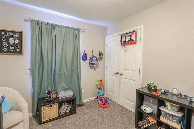 1215 Nottingham Dr, Warrensburg, MO 64093 - playroom featuring baseboards and carpet flooring