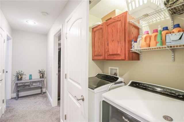 1215 Nottingham Dr, Warrensburg, MO 64093 - washroom with baseboards, washing machine and dryer, cabinet space, and light colored carpet