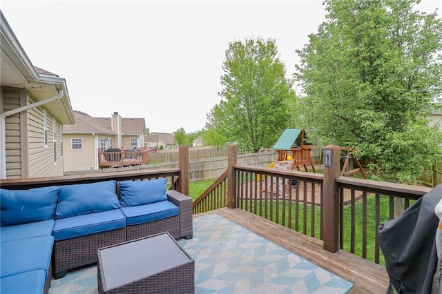 1215 Nottingham Dr, Warrensburg, MO 64093 - deck with a fenced backyard, an outdoor living space, a playground, a lawn, and a residential view