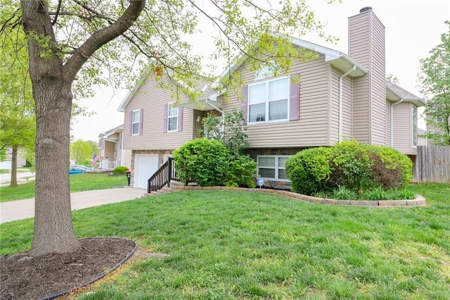 1215 Nottingham Dr, Warrensburg, MO 64093 - raised ranch with an attached garage, driveway, a chimney, and a front yard