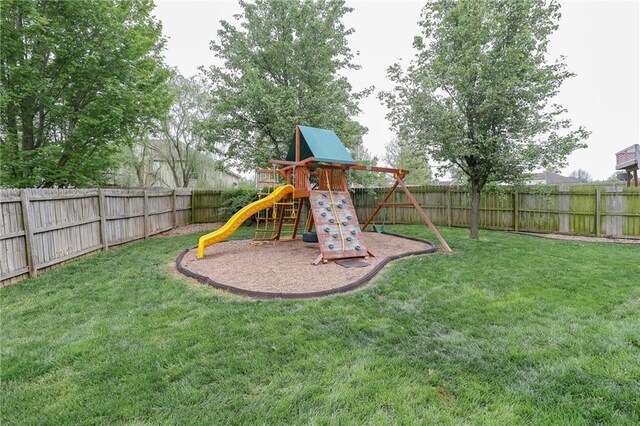 1215 Nottingham Dr, Warrensburg, MO 64093 - view of jungle gym featuring a fenced backyard and a yard
