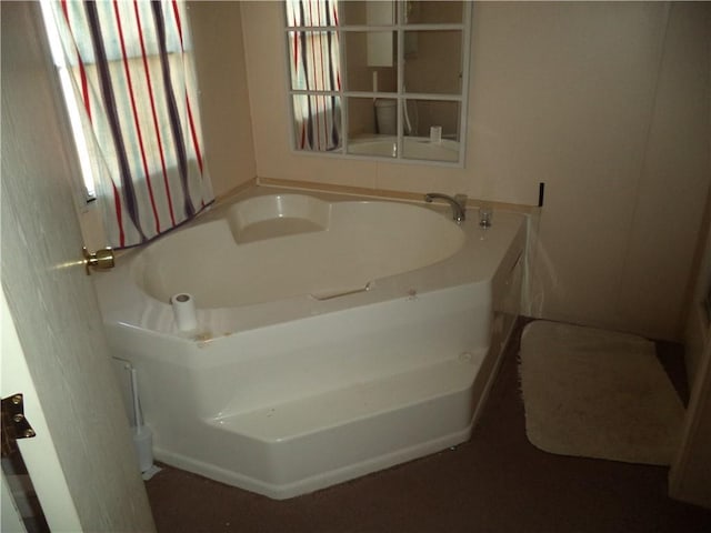 full bath with a garden tub