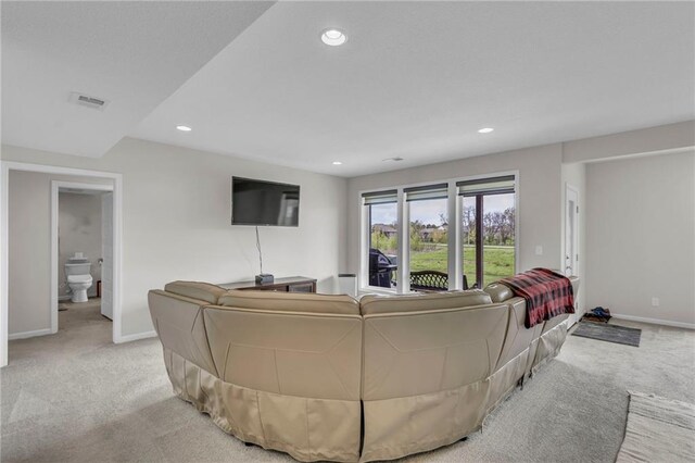 living area with baseboards, visible vents, recessed lighting, and light colored carpet