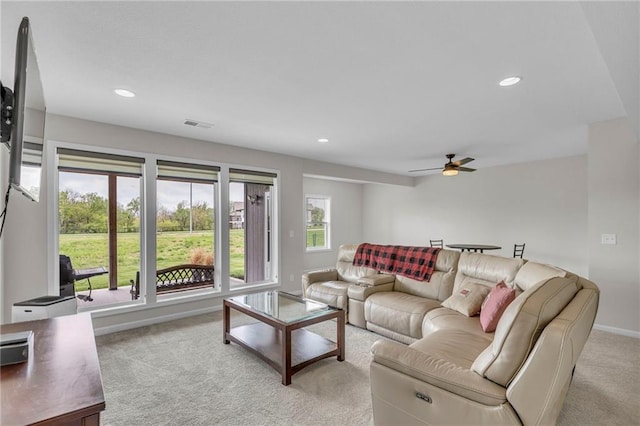living room with recessed lighting, ceiling fan, visible vents, and light carpet