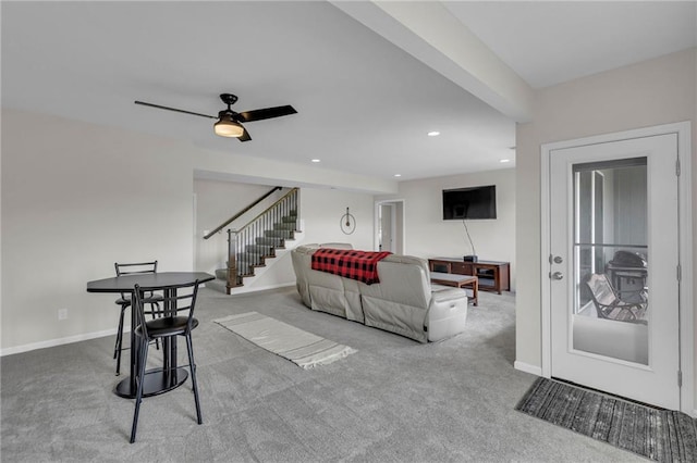 living area featuring recessed lighting, baseboards, carpet, and stairs