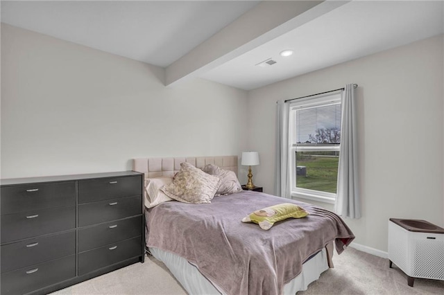 bedroom featuring carpet floors, baseboards, visible vents, and beam ceiling