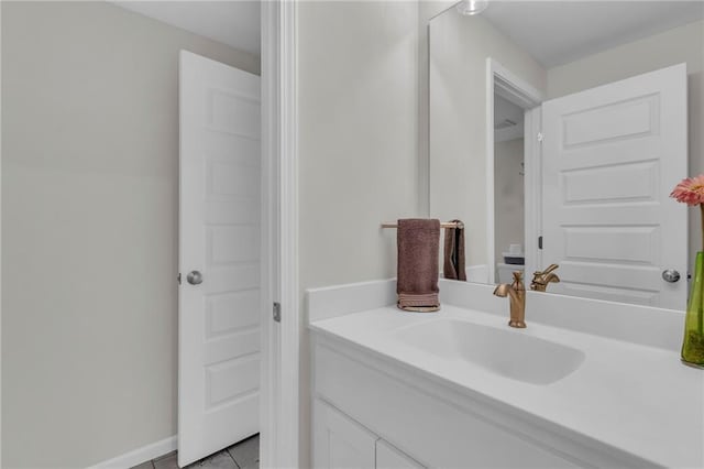 bathroom with tile patterned floors and vanity