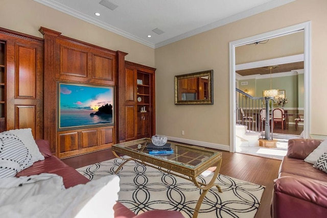 9705 Sunset Cir, Lenexa, KS 66220 - living room featuring dark wood-style floors, an inviting chandelier, baseboards, ornamental molding, and visible vents