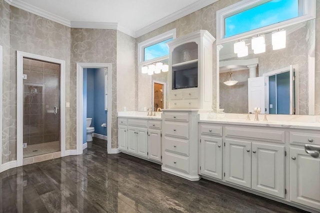 9705 Sunset Cir, Lenexa, KS 66220 - bathroom with toilet, vanity, crown molding, baseboards, and a stall shower