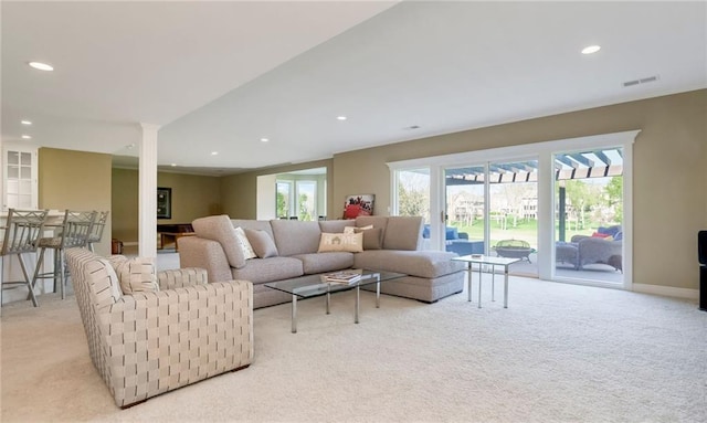 9705 Sunset Cir, Lenexa, KS 66220 - living room featuring recessed lighting, ornate columns, visible vents, and light colored carpet
