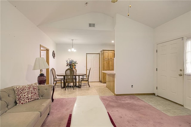 living area with an inviting chandelier, light tile patterned floors, baseboards, visible vents, and lofted ceiling