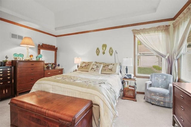 carpeted bedroom with a raised ceiling and visible vents