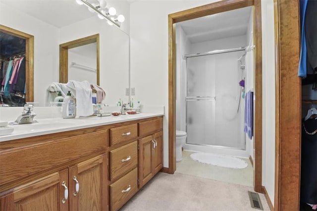 full bath featuring visible vents, a sink, double vanity, and a stall shower