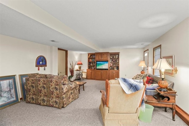 living room featuring carpet flooring and visible vents