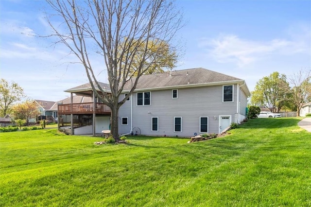 back of house with a yard and a deck