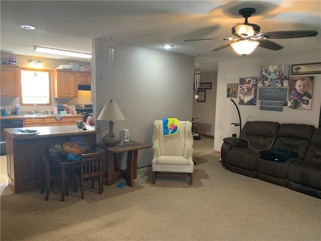 living room with a ceiling fan, recessed lighting, and light colored carpet