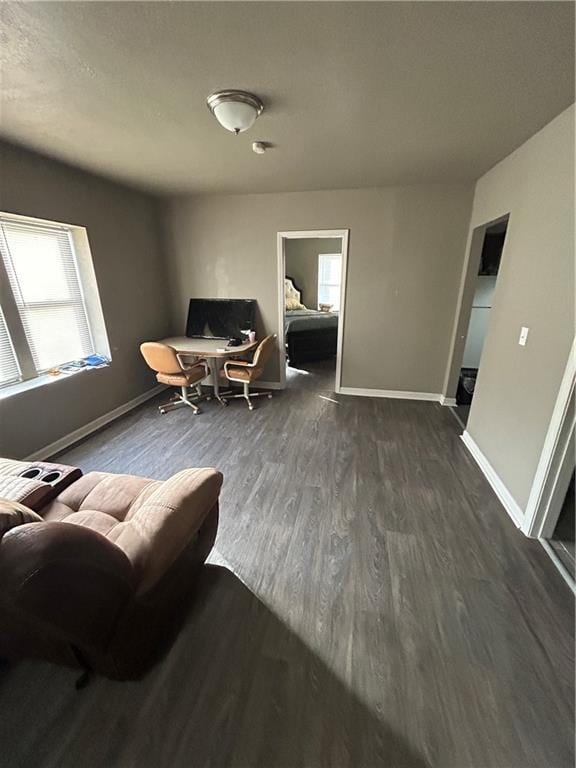 118-148 N Lawn Ave, Kansas City, MO 64123 - living room with baseboards and wood finished floors