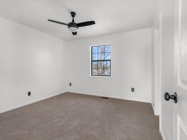 5836 Blue Ridge Blvd, Raytown, MO 64133 - unfurnished room featuring visible vents, carpet flooring, baseboards, and a ceiling fan