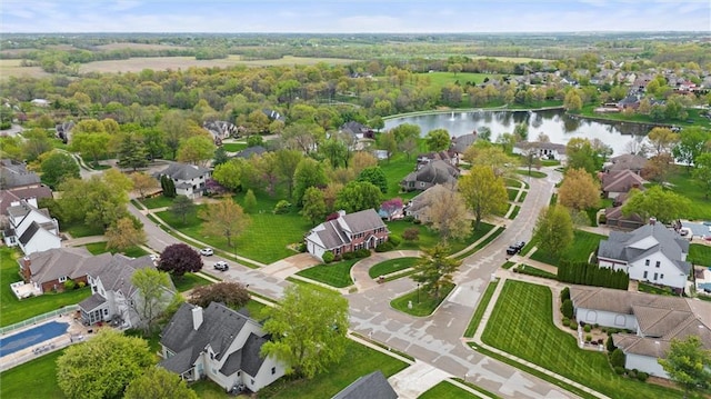 bird's eye view featuring a water view and a residential view
