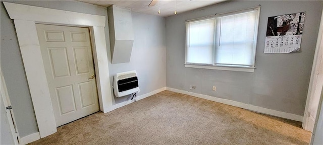 124 W 3rd Ave, Garnett, KS 66032 - interior space featuring baseboards and heating unit
