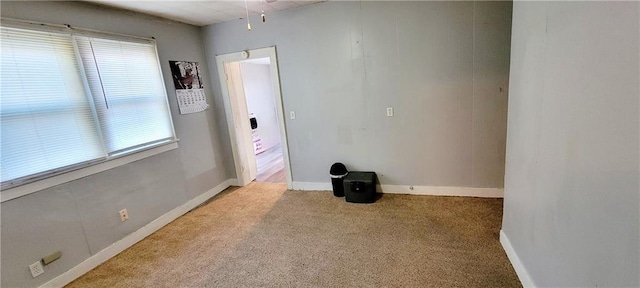 124 W 3rd Ave, Garnett, KS 66032 - carpeted spare room with baseboards