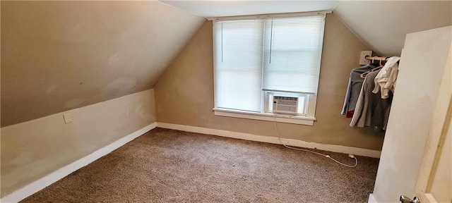 124 W 3rd Ave, Garnett, KS 66032 - additional living space featuring baseboards, lofted ceiling, carpet flooring, and cooling unit
