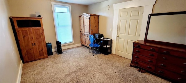 124 W 3rd Ave, Garnett, KS 66032 - bedroom with light colored carpet and baseboards