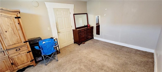 124 W 3rd Ave, Garnett, KS 66032 - interior space with light carpet and baseboards