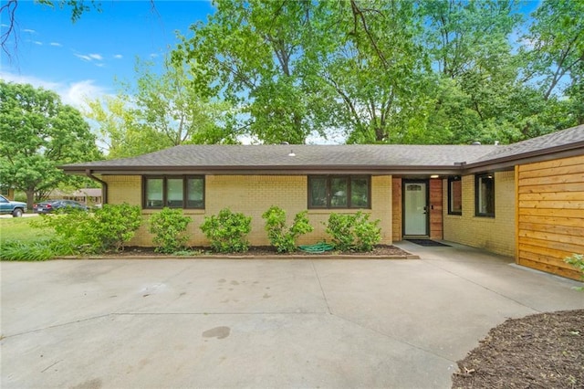 1804 Kenmar Dr, Manhattan, KS 66502 - ranch-style home with brick siding, driveway, and a shingled roof
