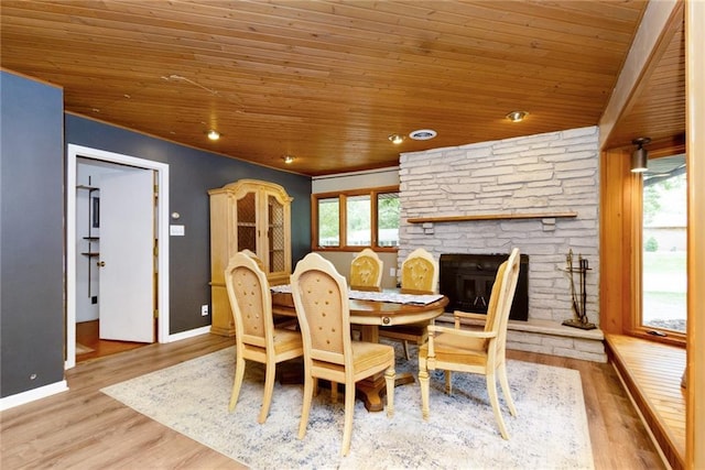 1804 Kenmar Dr, Manhattan, KS 66502 - dining area with wooden ceiling, a fireplace, wood finished floors, and baseboards