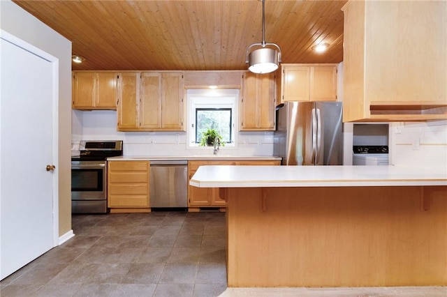 1804 Kenmar Dr, Manhattan, KS 66502 - kitchen with appliances with stainless steel finishes, wood ceiling, light countertops, a sink, and a peninsula