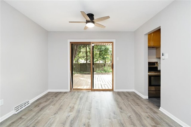 1804 Kenmar Dr, Manhattan, KS 66502 - empty room featuring light wood-type flooring, ceiling fan, and baseboards