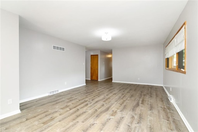 1804 Kenmar Dr, Manhattan, KS 66502 - empty room with light wood-style floors and baseboards