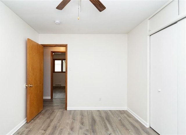 1804 Kenmar Dr, Manhattan, KS 66502 - unfurnished bedroom with light wood-style floors, a closet, baseboards, and ceiling fan