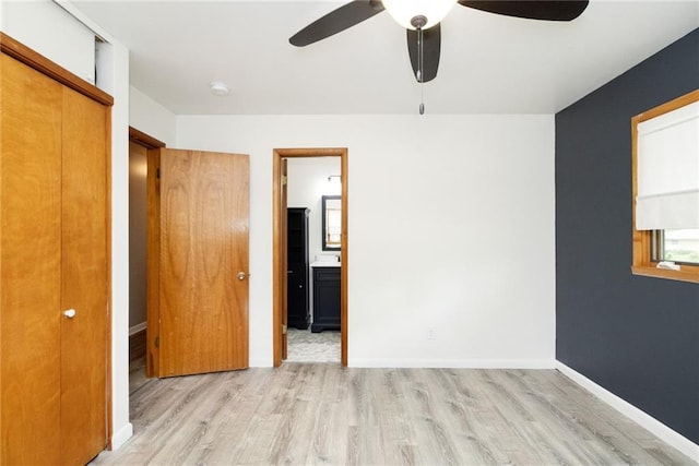 1804 Kenmar Dr, Manhattan, KS 66502 - unfurnished bedroom featuring light wood-style flooring, ensuite bath, baseboards, a closet, and ceiling fan