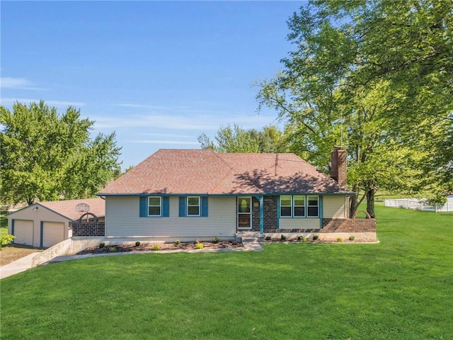 ranch-style home featuring a front yard, a detached garage, and a chimney