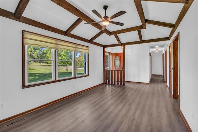 empty room with baseboards, wood finished floors, and a ceiling fan