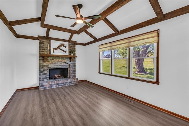 unfurnished living room featuring wood finished floors, baseboards, a ceiling fan, and a fireplace