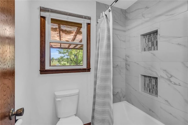 full bath with toilet and shower / bath combo with shower curtain
