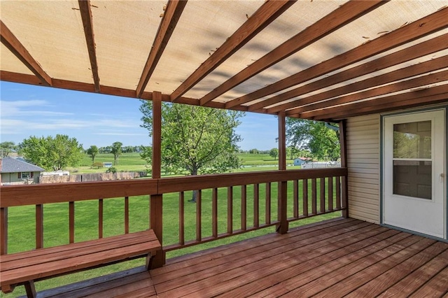 wooden deck featuring a yard and golf course view