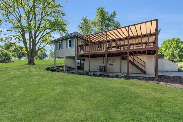 back of house featuring a wooden deck, a lawn, cooling unit, and stairs